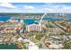 Stunning aerial view of a waterfront condo complex near tennis courts and waterways at 10355 Paradise Blvd # 1003, Treasure Island, FL 33706