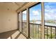 Relaxing screened in balcony with seating, coffee table, ceiling fan and expansive water views at 10355 Paradise Blvd # 1003, Treasure Island, FL 33706