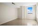 Neutral bedroom offering a sunny window and roomy closet space, perfect for organizing belongings at 10355 Paradise Blvd # 1003, Treasure Island, FL 33706