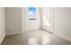 Neutral bedroom offering a sunny window and roomy closet space, perfect for organizing belongings at 10355 Paradise Blvd # 1003, Treasure Island, FL 33706