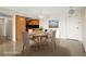 Dining space featuring a modern chandelier with a view into the adjacent kitchen at 10355 Paradise Blvd # 1003, Treasure Island, FL 33706