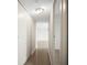Bright hallway featuring neutral walls and access to rooms with plenty of storage space at 10355 Paradise Blvd # 1003, Treasure Island, FL 33706