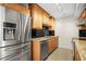 Bright kitchen features stainless steel appliances, granite countertops and black backsplash at 10355 Paradise Blvd # 1003, Treasure Island, FL 33706