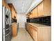 Spacious kitchen with stainless steel appliances, granite counters and modern lighting at 10355 Paradise Blvd # 1003, Treasure Island, FL 33706