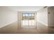 Bright, open living area with large windows offering scenic views and plenty of natural light at 10355 Paradise Blvd # 1003, Treasure Island, FL 33706