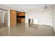 Spacious living area boasts neutral colors, modern lighting, and smooth flooring at 10355 Paradise Blvd # 1003, Treasure Island, FL 33706
