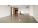 Open concept living area offers ample space and natural light with modern finishes and fixtures at 10355 Paradise Blvd # 1003, Treasure Island, FL 33706