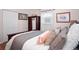 Comfortable bedroom with a bed, closet, and natural light at 10410 Ventura Ave, Tampa, FL 33619