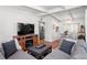 Cozy living room featuring a sectional sofa, hardwood floors and an open floor plan at 10410 Ventura Ave, Tampa, FL 33619