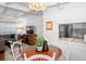 Open-concept living area flows with the dining area and kitchen and features stylish furnishings at 10410 Ventura Ave, Tampa, FL 33619