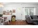 Bright living room featuring hardwood floors, an exterior door and a sun-lit window at 10410 Ventura Ave, Tampa, FL 33619