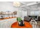 Living room featuring hardwood floors, a sun-lit window and stylish furnishings at 10410 Ventura Ave, Tampa, FL 33619