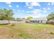 Spacious fenced backyard with a screened-in patio and ample space for outdoor activities at 10538 Juliano Dr, Riverview, FL 33569