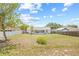 Spacious backyard with a white vinyl fence and a wooden fence at 10538 Juliano Dr, Riverview, FL 33569