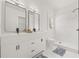 Elegant bathroom with double vanity, marble accents, and a glass-enclosed shower for a spa-like experience at 10538 Juliano Dr, Riverview, FL 33569