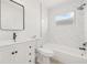 Beautiful white bathroom featuring a shower, toilet, vanity, and light at 10538 Juliano Dr, Riverview, FL 33569
