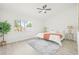 Serene bedroom with natural light, a ceiling fan, and neutral decor for a calming retreat at 10538 Juliano Dr, Riverview, FL 33569