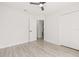 Bright bedroom with a closet, view of a doorway, fan, and light colored floors at 10538 Juliano Dr, Riverview, FL 33569