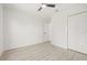 Bright bedroom with a closet, view of a doorway, fan, and light colored floors at 10538 Juliano Dr, Riverview, FL 33569