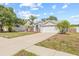 Lovely single-story home featuring a two-car garage, palm trees, and a well-maintained lawn at 10538 Juliano Dr, Riverview, FL 33569