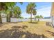 Wide open backyard featuring a shed and white privacy fence at 1128 Eau Claire Cir, Tampa, FL 33619