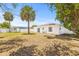 Large backyard featuring a shed and white privacy fence at 1128 Eau Claire Cir, Tampa, FL 33619
