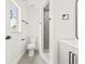 Bathroom with tiled flooring, a toilet, a vanity, and a tiled walk-in shower at 1128 Eau Claire Cir, Tampa, FL 33619