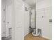 Utility room with water heater, closet and washer/dryer hookups at 1128 Eau Claire Cir, Tampa, FL 33619