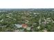 Aerial view of the property with a pool, marked by a red pin, surrounded by lush greenery in a neighborhood at 1139 43Rd N Ave, St Petersburg, FL 33703