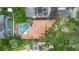Aerial view of property featuring a backyard pool, roof, and surrounding greenery at 1139 43Rd N Ave, St Petersburg, FL 33703