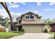 Charming tan two-story home with large windows and well-maintained landscaping for great curb appeal at 1139 43Rd N Ave, St Petersburg, FL 33703