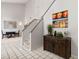 Staircase area with decorative accessories and a partial view into the dining area at 1139 43Rd N Ave, St Petersburg, FL 33703