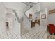 Bright foyer with tile flooring, staircase, and an open view into the spacious living area at 1139 43Rd N Ave, St Petersburg, FL 33703