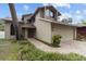 Inviting front exterior showcases a brick path, mature landscaping, and a neutral color palette at 1139 43Rd N Ave, St Petersburg, FL 33703