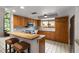 Beautiful eat-in kitchen with wood cabinets, stainless steel appliances, and granite countertops at 1139 43Rd N Ave, St Petersburg, FL 33703