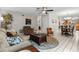 Inviting living room with tile floors, neutral walls, and cozy furniture arrangement at 1139 43Rd N Ave, St Petersburg, FL 33703