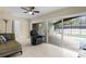 Bright living room with sliding glass doors leading to the pool area at 1139 43Rd N Ave, St Petersburg, FL 33703
