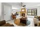 Spacious living room with a fireplace and large windows offering lots of natural light at 1139 43Rd N Ave, St Petersburg, FL 33703