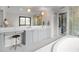 Main bathroom features double sinks, vanity, walk-in shower, and separate tub at 1139 43Rd N Ave, St Petersburg, FL 33703