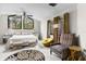 Tranquil main bedroom with vaulted ceiling and large windows offering serene outdoor views at 1139 43Rd N Ave, St Petersburg, FL 33703