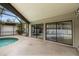 Screened-in lanai with swimming pool beyond sliding glass doors at 1139 43Rd N Ave, St Petersburg, FL 33703
