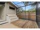 Screened-in pool area with wooden deck and pool equipment at 1139 43Rd N Ave, St Petersburg, FL 33703