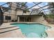Screened-in pool area with a swimming pool and partially visible house at 1139 43Rd N Ave, St Petersburg, FL 33703