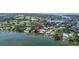 Aerial view of a waterfront property with private dock, offering direct access to waterways at 1238 Monterey Ne Blvd, St Petersburg, FL 33704
