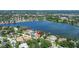 Beautiful aerial shot of waterfront homes nestled by a serene lake, offering picturesque views and a peaceful ambiance at 1238 Monterey Ne Blvd, St Petersburg, FL 33704