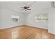 Cozy bedroom with natural light, hardwood floors, and a ceiling fan at 1238 Monterey Ne Blvd, St Petersburg, FL 33704