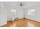 Clean bedroom with hardwood floors and two windows providing natural light at 1238 Monterey Ne Blvd, St Petersburg, FL 33704
