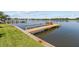 Private wooden dock for easy water access and scenic views of the water from the property at 1238 Monterey Ne Blvd, St Petersburg, FL 33704