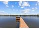 A wooden dock stands invitingly on the water, offering a serene spot for relaxation and contemplation at 1238 Monterey Ne Blvd, St Petersburg, FL 33704