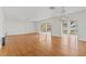Large living room featuring hardwood floors, neutral colors, and chandelier at 1238 Monterey Ne Blvd, St Petersburg, FL 33704